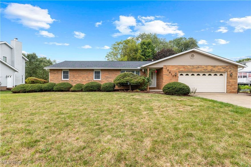 Welcome to this charming and spacious 3-bedroom 2 1/2 bath brick ranch that offers comfort, style and room to grow!  This home boasts a large eat-in kitchen perfect for hosting meals, a bright and inviting living room, and a cozy family room featuring a beautiful gas fireplace, ideal for relaxing evenings.  The master suite provides a peaceful retreat with its own private bathroom.  The partially finished basement is perfect for entertaining, featuring a bar area and plenty of space for games, hobbies, or a home gym.  Step outside through the walk-out basement to a beautiful patio, perfect for relaxing or hosting gatherings.  A large deck extends the outdoor living space even further. Complete with a 2-car heated garage, this home is designed for convenience and year round comfort.  Don't miss out!  Call today to schedule a private viewing!  Roof 2019, furnace and central air 2006. water softener 2024