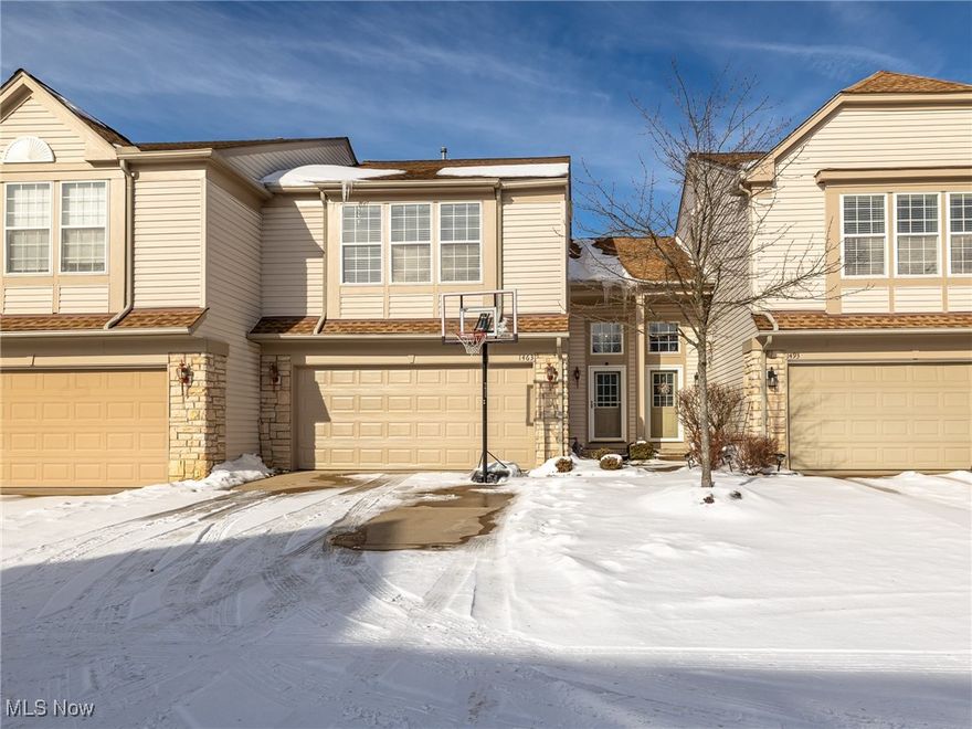 Welcome home to this beautifully updated 2 bedroom, 2.5 bath townhome in the sought after Courtyards of New Hampton community in Broadview Heights! This modern, open-concept home welcomes you with a dramatic two-story entry foyer, tall ceilings, and neutral paint and updated flooring throughout. The inviting living room features a cozy fireplace, perfect for relaxing or entertaining. The stylish kitchen offers updated stone countertops(2022), a stone accent wall, ample wood cabinetry, pantry, and all appliances included, flowing seamlessly into the dining area. A convenient half bath completes the main level. Upstairs, the gracious stairway leads to an open loft area, a spacious owner’s suite with a vaulted ceiling, walk-in closet and private bath with updated vanity, another comfortable bedroom, a 2nd full bath with new vanity, and a conveniently located laundry room. Step outside to enjoy your private patio with an updated stone wall (2025), ideal for outdoor dining or unwinding. Additional highlights include an attached 2 car garage. Enjoy low-maintenance living in a community w/ clubhouse, pool and playground close to shopping, restaurants, parks, and easy highway access. Move-in ready and beautifully maintained, this one is truly a must-see. Welcome home!