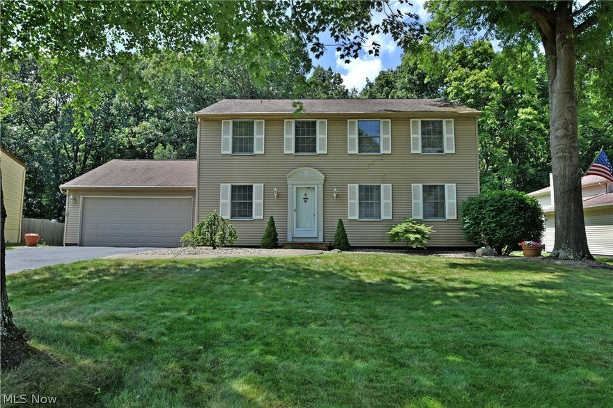 Don’t miss your chance on this beautiful two-story home, with three floors of living space and your own private resort out back! This residence is perfect for your large or growing family. The first floor includes a massive living room complete with hardwood style flooring, separated from the formal dining area by the carpeted staircase and a tiled hall leading to the kitchen area. A half bath is located nearby along with basement access. A spacious kitchen filled with wooden cabinetry shares the floor with an eat in dining area set before sliding glass doors leading to an enormous covered rear patio area. A family room with fireplace resides at the far end of the living space. Upstairs, four ample bedrooms provide more than comfortable living quarters as they vary in size. Each room is trimmed with carpeted flooring and offers relative closet space. The master bedroom is complete with a unique private bath area with bespoke vanity and dressing room. An additional recently updated full bath rounds out the second floor. Downstairs, a partially finished basement offers rec space, laundry and extra storage. The crowning jewel of the home however is the fenced in backyard, with a stunning inground pool, hot tub, wooden storage shed and prominent covered patio/cabana area for dining and entertaining!