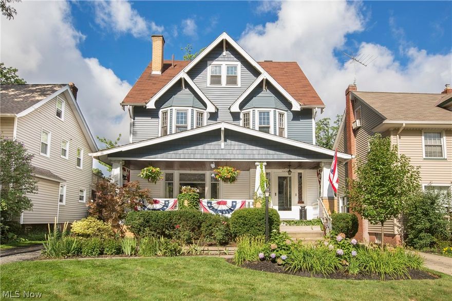 Prepare to be Moved!... into this gem of a Lakewood colonial.  Stunning landscaping & graceful bay windows tempt the eye & let you know that something special waits beyond the wide & welcoming front porch.  Refinished hardwood floors throughout paired with crisp white woodwork & trim give a classic yet fresh feel to each room.  The fireplace with efficient stove insert, flanked by leaded glass windows, makes a striking focal point in the living room.  Equally charming in the adjacent dining room is the timeless window seat set between built-in shelves & drawers.  Decorative wainscoting & open beam details add to the elegant atmosphere.  The recently redone kitchen projects a lively vibe with its open cabinets, snappy color scheme, back stairs & cozy banquette booth.  On the 2nd floor, the huge Master Bedroom boasts those two graceful bay windows, complete with window seats.  Two additional bedrooms along with the chic & newly renovated bath complete this level.  The fully finished thir