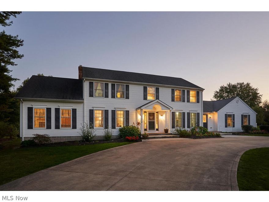 Large Hudson colonial with 2 Owner's suites.  The Owner's suite on the main level has a fireplace, trayed ceiling, large bath with jetted tub, shower, double sinks and walk in closet.  There is a living room off this suite.  Second floor Owner's suite has an updated bathroom and is located with the other 4 bedrooms. The second floor hall bathroom has also been updated. The first floor office has a separate entrance with a large foyer and bathroom. 12X20 indoor pool is accessible from the dining room through French doors. The pool room was constructed with a Dryvit stucco system. Updated eat-in kitchen with granite countertops, center island, fully applianced with double ovens. Large dining room and large family room with fireplace. First floor laundry. 4 car attached garage. Large wrap around composite deck and gazebo will stay. Zoned heating, tankless hot water tank, Kinetico drinking water purifier, security system and home warranty.