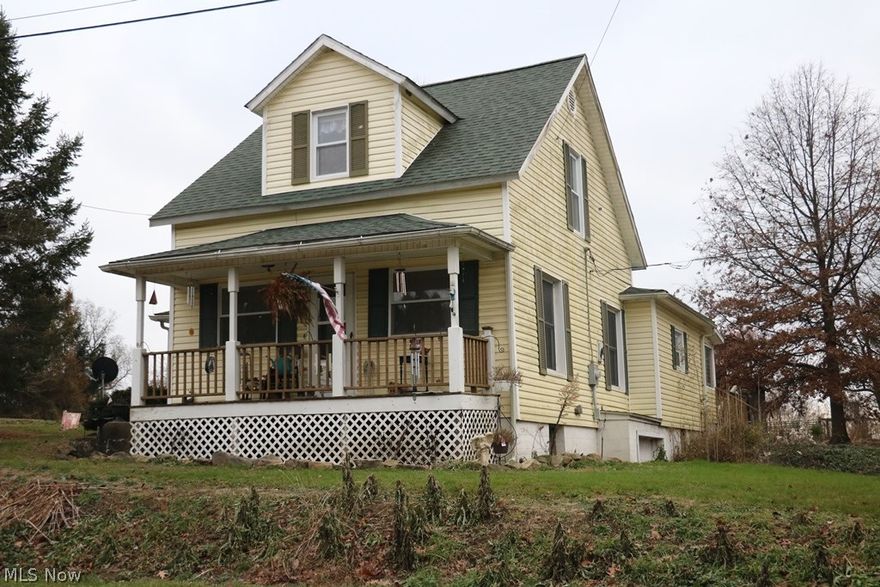 Here's this 4 br. 1 bath older 2 story home with 1st floor master bedroom and laundry just off the kitchen area.  The home has an eat in kitchen with pantry and formal dining area, spacious bath and open living room.  There's a sun room, covered porch and large deck for entertaining guest and private level back yard with a one car garage in the walk out basement for added storage.  The home has a wood burning furnace for backup heat, or propane heat.  It will be sold with all mineral rights that the seller owns which are currently leased til 2017.  Comes with a home warranty thru HSA $485.  The roof was replaced on the house 8 years ago and on the porch last year.  Windows done in 2003, new laminate floors in kitchen, and new electric box with 200 amp service 2012.   The enormous barn has 2 stalls and loft area for hay, and open ended for storage and has electric and water.  A must see if you have horses.  There's plenty of open field with tree lined lot.  Dog kennel does not stay,