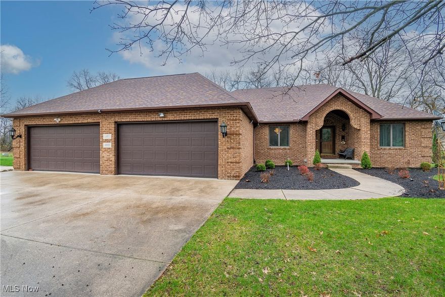 Welcome to your private oasis in the Medina School District! This beautifully maintained all-brick, 3-bedroom, 2-bathroom ranch sits on a stunning 5-acre double parcel lot offering space, serenity, and a lifestyle of comfort. Step inside to discover a thoughtfully designed layout featuring a private owner’s suite complete with a walk-in closet, double vanity, soaking tub, and walk-in shower. The spacious living and dining rooms were updated with new carpet in 2023, and the cozy vent-free gas fireplace sets the perfect ambiance for chilly Ohio evenings. The heart of the home is the large kitchen, outfitted with newer stainless steel appliances including an oversized gas/electric range, ideal for entertaining or everyday meals. A first-floor laundry room with a utility tub and included washer & dryer adds convenience. Two additional large bedrooms and a second full bathroom round out the main level. Downstairs, enjoy a finished basement with luxury vinyl plank flooring, a storm/tornado room, and a possible 4th bedroom—perfect for guests, hobbies, or a home office. The whole house vacuum system, reverse osmosis water filtration, and security system enhance your everyday ease. Outdoor living shines with a composite back deck overlooking a picturesque, stocked 1-acre pond (gazebo stays!) and beautiful 2021-updated landscaping dotted with fruit trees, blueberry bushes, and Dawn Redwoods. Additional highlights include: heated 4-car attached garage, outbuilding (30x24) with side porch, and FREE GAS. Updates include: roof 2022, generator 2023, furnace recently serviced, updated bathroom with walk-in shower, septic inspected & serviced 2024. This property offers a rare blend of rural charm and modern amenities—perfect for those seeking space, privacy, and a place to truly call home.