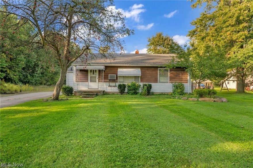 This home sits on 5-parcels Zoned Light Industrial (Commercial). There is another brick ranch PLUS a huge garage with high overhead doors. Property offers many possibilities. Location is minutes to I-480 and 15 minutes to Cleveland Airport. Family owned for over 60 years! Seller has paid sewer tie-in fee. Call today!