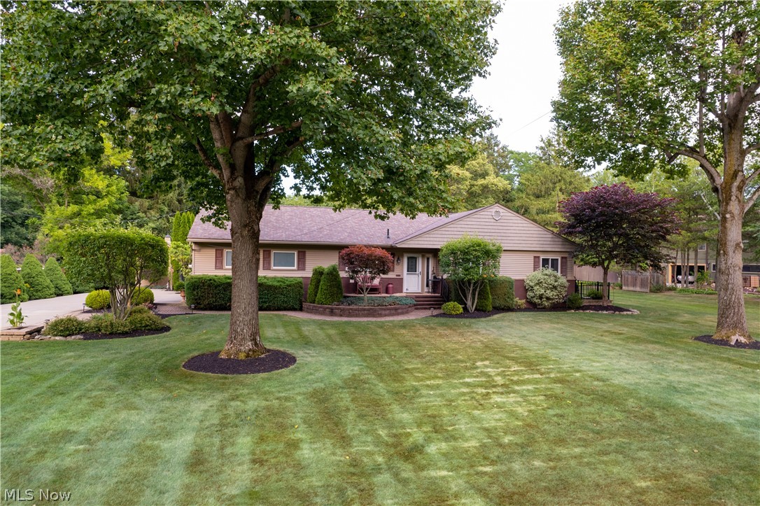 Beautifully updated & meticulously maintained inside & out, this Ranch home abutting the Oneil Woods Metro Park/Cuyahoga Valley National Park is sure to go fast! The bright & open floor plan has great views throughout of the professionally manicured gardens & grounds and 32' x 16' heated inground pool.... like being on vacation in your own back yard! The Kitchen features custom Schrock cabinetry, granite countertops, stainless steel appliances, & breakfast bar open to the living room. Other upgrades include gorgeous hardwood flooring, custom interior doors and large glamour bath. The Sun/3 season room leads to the patio featuring a Sunsetter awning---offering a relaxing place to entertain family & friends. The lower level includes a spacious Rec room with Miracle Stone
flooring --fireplace---2nd full bathroom--utility area with updated mechanicals. Outside features include newer concrete drive, fencing, landscaping, pool shed with pool equipment, garden shed, & updated well & septic. This home is located in the highly desirable Revere School District too!
Call today for your private appointment.... you'll be glad you did!
