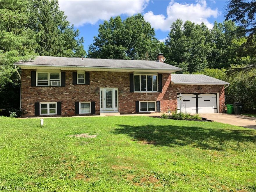Come see this 4 bedroom 1.5 bath on almost a full acre. in Peninsula Ohio. This Bi-level home has updated flooring, new septic, a rustic lava rock fireplace, a large expansive lawn with a cement patio area, full bath features a step in shower, and is located in Hudson schools. Come see this one and appreciate a little country living.  Call for your private showing today.