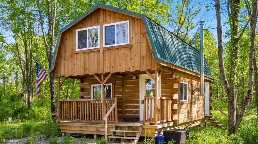 What a unique opportunity to own a beautiful cabin in the woods! You must see this Log Cabin nestled on 5 +/- acres in Muskingum County. The locally-built Amish cabin is surrounded by woods and is a recreational paradise (.5 miles to Tri-Valley Wildlife Area, 1 mile to AEP/ODNR Conesville Recreation Area, 3 miles to Wills Creek Lake, 10 miles to Dresden with Muskingum River Access). The property features a new gravel driveway with gated entrance and a trail system lined with hardwood and pines. The cabin is tucked away along a dead end road. A diverse property with tons of deer, turkey and other wildlife. This property would make an excellent hunting or recreational retreat, permanent residence, or investment. The cabin features one large bedroom and one bathroom with a custom-built sliding barn door. The fully-functioning cabin is setup with electric, county-approved septic and well water. The living area features a functioning wood burning cook stove. Lovely porch w/ amazing, peaceful views. 1 hour 20 minutes to Columbus, 1 hour to New Albany,  45 minutes to Newark, 30 minutes to Zanesville, 20 minutes to Coshocton. Just a short drive to Rosco Village, Dillon Lake/State Park, Amish Country, and the Wilds Safari Park.-