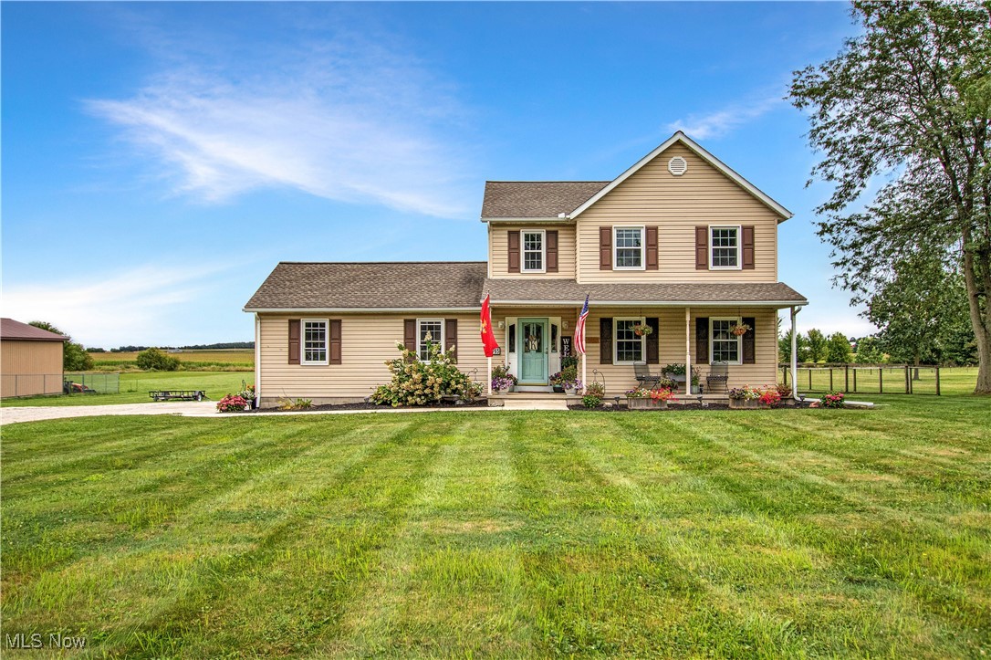 Welcome home to this stunning colonial set on just over 2 acres with breathtaking rolling hill views, perfect for enjoying the best sunsets from your spacious front porch or back deck. Step inside to a bright and airy living room filled with natural light, seamlessly flowing into the eat-in kitchen. The kitchen features quartz countertops, a generous pantry, and updated appliances that stay. A dining area opens to the back deck, creating an ideal setup for entertaining or simply relaxing while taking in the serene country backdrop. Upstairs, you'll find three generously sized bedrooms and a full bathroom. The partially finished basement, fully waterproofed in August 2025, offers additional living space and brand-new flooring (8/25) while maintaining plenty of room for storage. Convenience and updates abound: Furnace & A/C replaced (July 2025), Sump pump & hot water tank (2024), Driveway gravel (2024), Reverse osmosis system + water treatment (2019), Roof, windows, and many other big-ticket items already done!
Additional features include a fenced-in section of yard (2022), a large shed (2022), and an attached 2-car garage with an updated half-bath featuring shiplap and quartz counters. This move-in-ready home blends modern updates with country charm and space to spread out. Don't miss your chance to make it yours!