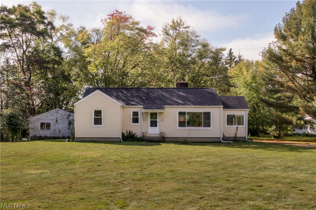 Location! This home rests in the heart of Tallmadge with Tallmadge Schools adjoining the rear property line and the Rec. Center and Tallmadge Circle a minute away. Great lot, nearly 2 acres! All the major mechanicals have been updated; roof, siding, windows, gutters, insulation, furnace, air and hot water heater. Professionally waterproofed dry basement. Three bedrooms, one full bathroom. Hardwood floors. Public water and sewer. 3-car garage. Update the interior of this home to your taste and secure a GREAT property in Tallmadge! Schedule your private viewing today.