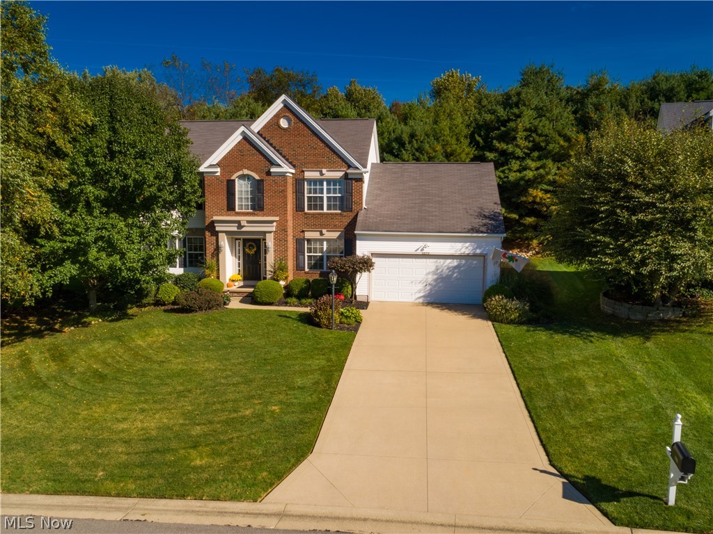 An absolute gem! This 4 bedroom/2.5 bath colonial shows like a model* Built 2001 with approx. 1964SF & situated on lovely professionally landscaped private lot bordering green space* 9’ ceilings 1st flr* Foyer, formal dining & eat in kitchen with wood floor & detailed crown molding* Spacious bayed kitchen with stainless appliances ( 5 burner gas range, refrig, microwave & dishwasher—2018 with warranty), granite counter top, glass tile backsplash, sink, faucet & updated lighting (2016)* Eating area with updated Pella door with built in blinds & transferable warranty* Great room with crown molding & ventless gas log fireplace* Living room/den with crown molding* 1st floor laundry with cupboards, utility sink & closet* 1st floor half bath* Vaulted master with fan, plant ledge, walk in closet & vaulted master bath with garden tub & shower* 12 course unfinished basement with poured walls & glass block windows* Private deck with abundance of wild life* Landscape lighting* Sprinklers front &