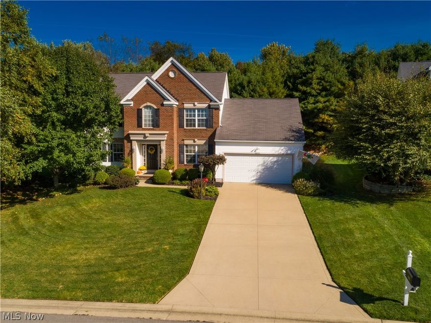 An absolute gem! This 4 bedroom/2.5 bath colonial shows like a model* Built 2001 with approx. 1964SF & situated on lovely professionally landscaped private lot bordering green space* 9’ ceilings 1st flr* Foyer, formal dining & eat in kitchen with wood floor & detailed crown molding* Spacious bayed kitchen with stainless appliances ( 5 burner gas range, refrig, microwave & dishwasher—2018 with warranty), granite counter top, glass tile backsplash, sink, faucet & updated lighting (2016)* Eating area with updated Pella door with built in blinds & transferable warranty* Great room with crown molding & ventless gas log fireplace* Living room/den with crown molding* 1st floor laundry with cupboards, utility sink & closet* 1st floor half bath* Vaulted master with fan, plant ledge, walk in closet & vaulted master bath with garden tub & shower* 12 course unfinished basement with poured walls & glass block windows* Private deck with abundance of wild life* Landscape lighting* Sprinklers front &