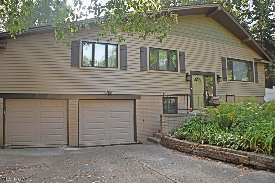 You'll fall in love with this 5 bedroom, 2.5 bath home as soon as you step in. The main floor's kitchen and living areas are open to each other, making family time a breeze. Walk down the hall to the master suite to find a light-filled sitting room and private balcony area off the bedroom area! The lower level family room with it's own bar area and half bath is perfect for entertaining. Lower level HUGE laundry area features a walk out into the beautiful backyard. There, you'll find lovely landscaping and a designated fire pit area. Come see it for yourself today!