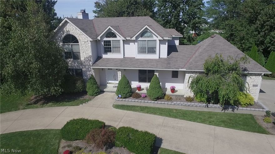 Truly Gorgeous New Granite Kitchen in this partial Stone Front/Relaxing Front Porch, Redtail Beauty situated on an oversized lot w/ circular drive & side load garage...Custom raised deck overlooks the partially treed lot! Enter to a light filled foyer w/dramatic ceiling and large windows. The New Kitchen is perfect in everyway along with Granite, Glass tile, Premium Appliances...elegant pendulum lights for that added touch. Stunning New Cherry Wood Flooring that will impress & excite you. Open concept w/large windows in family room divided from the formal living/Den w/New glass French Doors. Formal Dining includes decorative Ceilings & crown moulding. Owner's suite is oversized w/vaulted ceilings, round top windows, walk in closet & glamour style bath that is sure to pamper. 4 bedrooms so everyone has their space. 1st floor laundry. Remodeled bath & so much more...