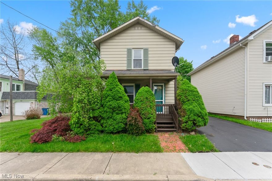 Move-in ready and cosmetically updated, this 2-bedroom, 1.5-bath Niles home blends modern touches with functional space. Step onto the charming front porch and into a spacious living room featuring luxury vinyl plank flooring that continues throughout the entire main level. The adjoining dining area offers plenty of room for entertaining. The kitchen is equipped with new white cabinetry, laminate countertops, a double stainless-steel sink, and a bonus area for added storage and prep space. The full bathroom and laundry room combo boasts tile walls, a new tub, and an updated vanity. Upstairs, you’ll find two carpeted bedrooms with ample closet space and a convenient half bath. The basement provides additional storage options, while the rear mudroom gives easy access to a small fenced-in yard. Additional highlights include a blacktop driveway, 100-amp electric panel, and forced air furnace with central air.