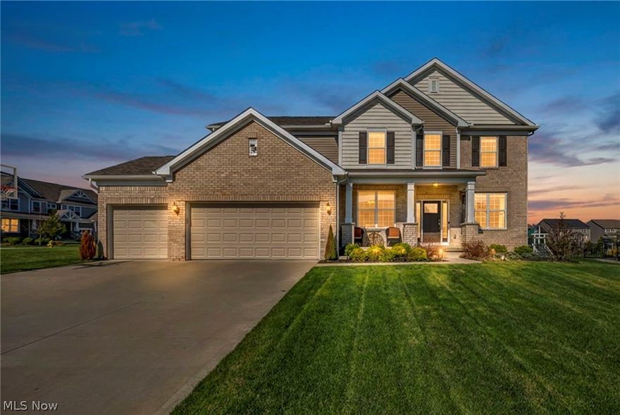 (4K Video Available) Elegant, well-appointed, & sun-filled custom home in highly sought-after Miller's Farm in Copley Township, offering access to top-rated Revere Local Schools. Spacious 5-bedroom, 3  bath home showcases dramatic architectural details, thoughtful upgrades, plus versatile layout ideal for modern living. Grand two-story foyer and great room create an impressive first impression, soaring ceilings, walls of windows, a cozy fireplace, & upgraded wrought iron spindles adding a refined touch. Main floor features mostly hard surface flooring & includes a private FIRST-FLOOR GUEST SUITE /full bath, perfect for guests or multi-generational living, along w/additional dedicated home office. Gourmet quartz kitchen is a true showpiece, complete w/massive chef’s island, 36” gas cooktop, wall oven, butler’s pantry/coffee bar, exceptional walk-in pantry. Built-in homework station adds everyday functionality, the open layout flows seamlessly into the main gathering space—perfect for entertaining. Upstairs, retreat to the luxurious owner’s suite through double doors, featuring a custom tiled bath w/dual sinks, walk-in shower, and ample closet space w/added custom cabinets. Additional bedrooms are generously sized to accommodate a variety of needs. Full, extra-deep basement is open/ready for finishing, already plumbed for a future bath. Outside, enjoy a wide lot w/oversized patio & mature landscaping, ideal for relaxing/hosting gatherings. Home also features a partial brick & shake exterior, welcoming front porch, large driveway, finished, insulated 3-car garage. Prime location just minutes from shopping, dining, highways—this exceptional home offers luxury, space, convenience in one of the area’s most desirable neighborhoods.