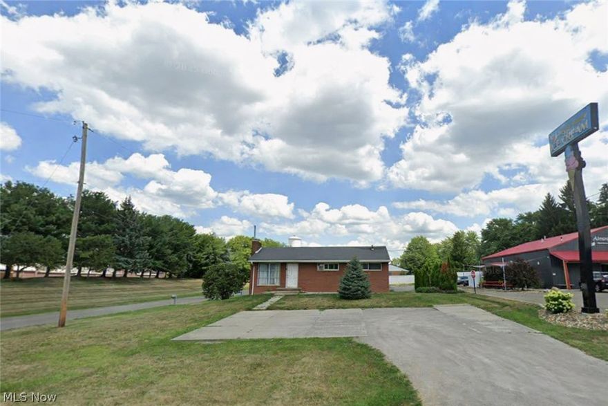 Perfect Commercial Opportunity in Alliance!  
Commercial-zoned brick ranch with city water and county sewer, positioned just off State St with excellent visibility and a strong traffic count. Large parking lot, flexible layout, and additional space underneath for expanded use. Located beside Almost Heaven Ice Cream. Ideal for a restaurant, salon, grooming business, office, or nearly any service-based operation.