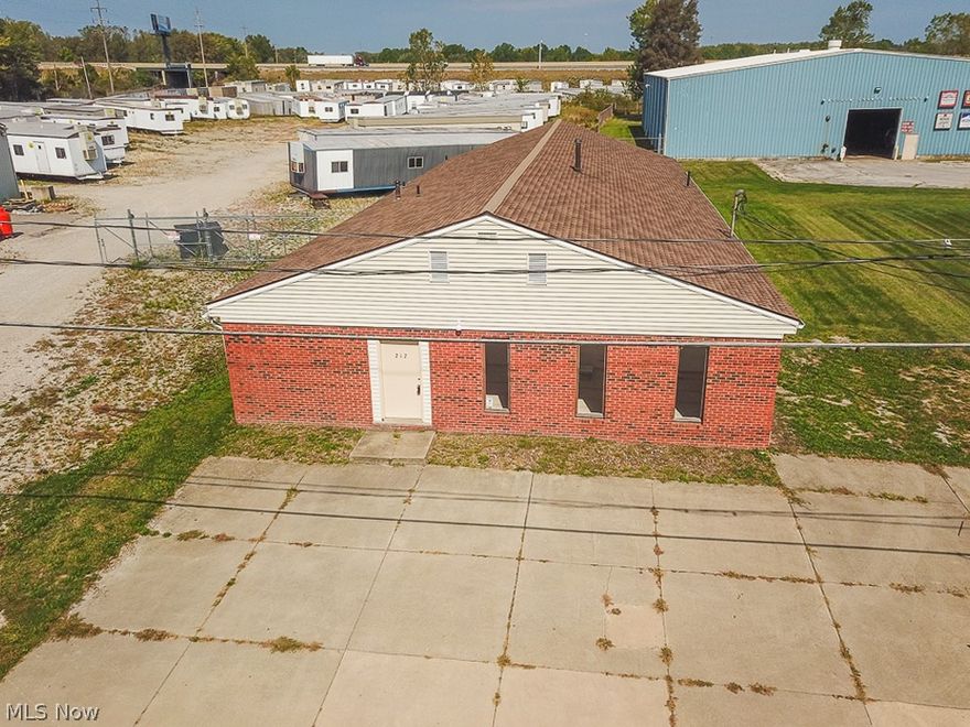 Excellent location & Exceptional Building (additional lot to East of building)with endless possibilities within minutes (Prime Location surrounded by other successful long term businesses) of the Ohio turnpike and I-90. Other business in this location include UPS, Duffin Manufacturing, Beverage storage, Houses of Worship, Trucking, Storage,etc. The building is comprised of approximately 50% office/showroom space and warehouse/shop area. The ceiling height in warehouse area is 11'9" and the overhead door is 8 x 8. Property being sold with 2 parcels totaling 92x137 - so there is plenty of room for additional parking or expansion. Heated by natural gas and and 220 - 3 phase electric service. Walls and ceiling are insulated - 22' of insulation in the ceiling. Concrete and stone parking lot. Building will lend itself to a multitude of uses and the floors in office areas can be removed if you want larger shop/warehouse space. This building is very well cared for with brick/block construction