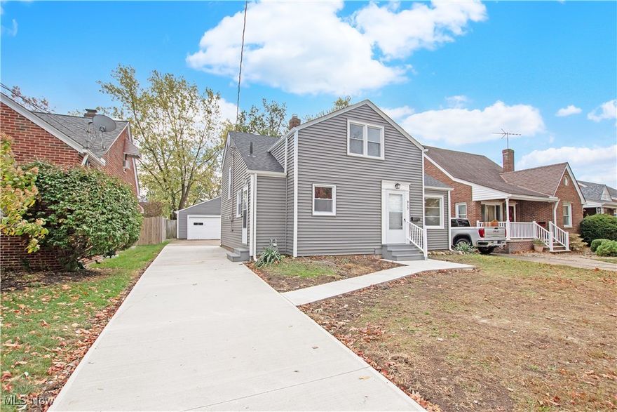 Fully remodeled 3-bedroom cape cod- split level style floor plan with lots of space to spread out! Large fenced in back yard with 2 car garage and parking pad. Tons of big-ticket updates include dimensional roof, gutters / down spouts, vinyl windows, vinyl siding, concrete sidewalk, service walk and 1/2 of the driveway, exterior doors, storm doors and steps all replaced 2025. Updated eat in kitchen with white cabinets, Vinyl plank flooring, new counter tops, fixtures and appliances including dishwasher (2025). Updated full bath (2025). Spacious lower-level family room, fresh paint, flooring, doors, millwork, hardware and carpet throughout, updated furnace (2025). Walk to the park!