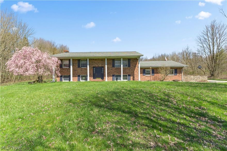 Welcome to your personal retreat! 1st time on the market. This stately home that sits back off the road on a sprawling 5-acre lot is a 1 owner custom-built home. The property features a stocked pond, perfect for fishing, and has both a 2-car attached garage AND a 2-car detached garage, with a loft for additional storage. The wooded area at the back of the lot offers privacy and a peaceful setting. The highlight of the home is its massive family room addition, complete vaulted ceiling, sky light, bay window, and a 9x7 bump out, that is perfect for an office or solarium. In the kitchen you will find beautiful granite countertops, an abundance of oak cabinetry with a lazy susan and pull-out shelving.  All appliances are included! A dining room and living room provide spaces for entertaining. The first floor includes a large bedroom, created by removing a wall, and another bedroom with 2 closets, one of which is set up for laundry. The lower level features a family room utilized as the owner's suite, complete with a fireplace, walk-in closet, and full bath with a step-in shower. Another room with full wall of bookshelves and a walk-in closet could serve as a fourth bedroom or library/office. Below the family room addition is a rec room complete with a wet bar and 2 storage rooms.  Outside, enjoy the patio with a pergola with built in seats, a playhouse, a dog house, and don’t forget the detached 2-car garage with a loft. The partially wooded lot offers privacy and a peaceful setting. The seller is including a 1 year 2-10 Home warranty for the buyer!  Make this impressive property your palace and schedule a showing today. Offers are due by noon on 4/23/24