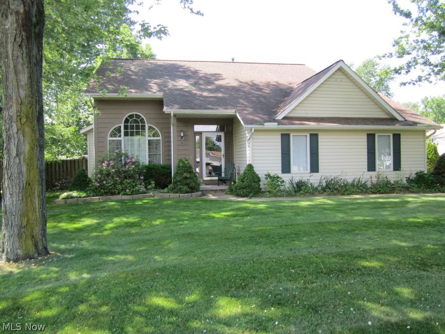 This is a former model home with many extras.  It has an open floor plan, large kitchen w/beautiful hardwood floors. Dining room has tray ceiling, wainscoting and glass sliding doors to the deck.  It has 4 bedrooms; master bedroom can either be on the first or 2nd floor, both with walk-in closets.  Excellent house for extended families.  It has deck and an outside patio.  The backyard is fenced.  The basement is partially finished.  It has laundry hook-ups in both the first floor and basement.  It has a gas hook-up for the outside grill. The house has vaulted ceilings on the first floor and 2nd floor. Gas fireplace on the first floor. Owner has recently installed a new water heater; upgraded the sump pump & installed new carpet and paint through most of the house. It has a 2 car attached car plus another 2 car garage, 4 in total.  The attached garage has a drain and a hot/cold water.  Attic space in both 2nd floor master bedroom & 2nd garage.  The house is located in the Garretts Cove.