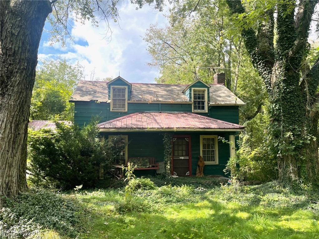 Value of this property is in the land. House needs demolished. This 6.31 acres of mostly wooded acreage is in Plain Township. Zoned I-1 primarily, the land also has a small portion zoned RR in the northwest corner of the property. There is a three-bedroom manufactured 784 square foot home with an address of 2805 Columbus Road NE. The property has two small barns as well.