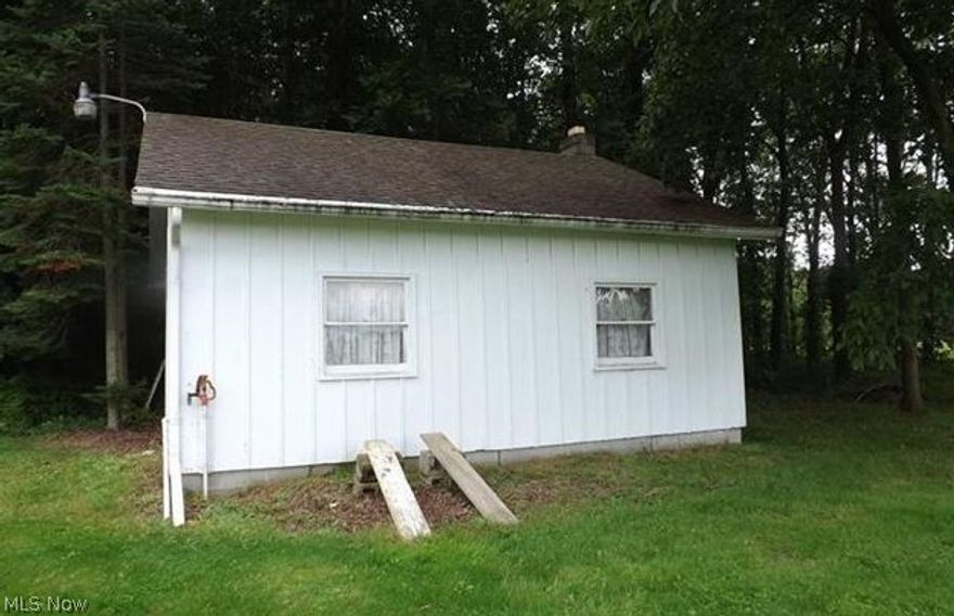 1.53 acre building lot. City water at street. There is a 484 sf building on property which could come in handy while building yourself a new home.