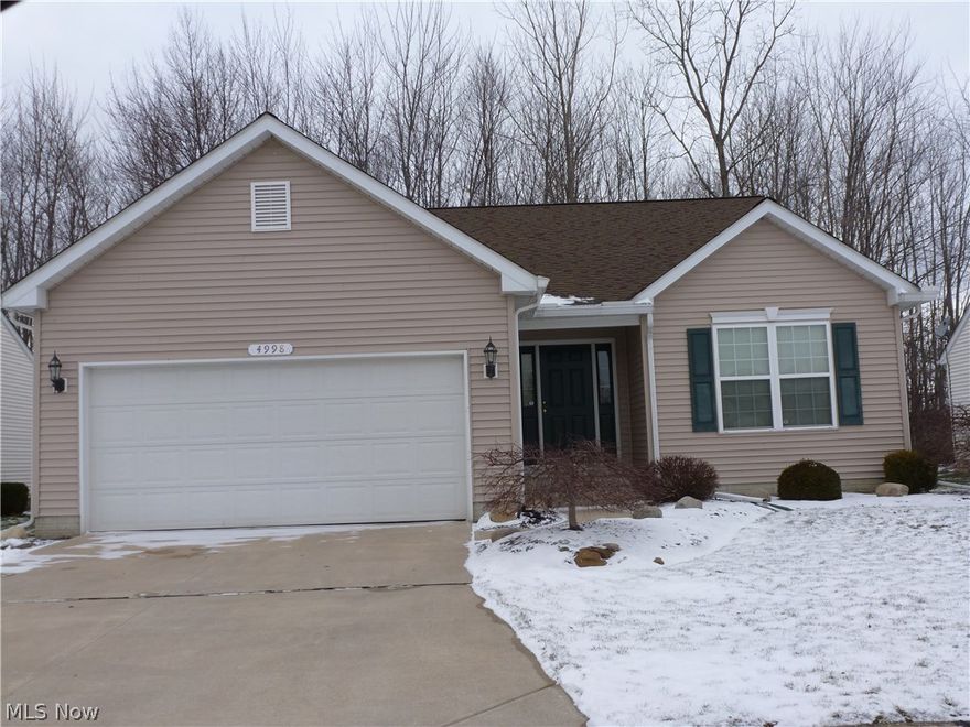 Lovely 2 bedroom 2 full bath Cluster Home on a lot that backs up to woods.  This home features an open airy floor plan.  The Kitchen features an eat in area, ample counter top space and cabinets.  All of the appliances stay.  There is a first floor laundry room.  The current location for the washer and dryer is in the full basement.  The master bedroom boasts a spacious master bath and a walk in closet.  The full basement has a work bench that will stay. The decor is all neutral easy to bring in your finishing touch!  Call today to see this home.