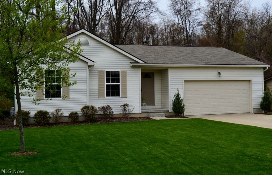 Absolutely wonderful three bedroom quality built ranch on a private treed corner lot.  Backs up to Sippo parks!  Current owner added many beautiful updates such as:  recessed lighting in great room, laminate wood look floor in kitchen and foyer, paint, light fixtures, patio and steps, landscaping, crown molding on cabinets.  Kitchen has stainless appliances and overlooks the stunning backyard.  First floor laundry.  Basement is 13 course.  The large master suite has  a full bath and there is a second full bath.  This home is well cared for and move-in ready.  Close to marina, walking trail and library.  This home is a must see!