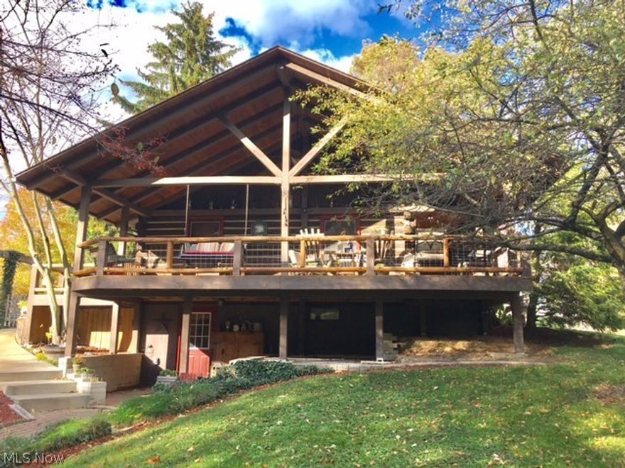 Peaceful country setting beautifully landscaped with trees and perennial gardens. This log home has 2 finished floors with a walkout lower level. There are 2 woodburning stoves for heating both levels There is also a propane (tank owned by seller and will stay) gas furnace. However, sellers choose to heat with wood. The first floor has wood and ceramic flooring, newer Schrock kitchen cabinets with stainless appliances. Attic has extra blown-in insulation. There is a 15X30 covered deck/porch to watch the sun set, great for entertaining, fenced brick patio off of the kitchen. 10X12 shed, 10X14 insulated shed with a dog run and an 8X10 shed attached to the garage for a tractor. This property is meticulously maintained showing pride of ownership. Gas and oil rights convey. Come see for yourself! You won't want to leave this place once you visit. Excluded items are as follows: kitchen island wagon wheel, workbench, water fountain, tool peg board and sink in garage.