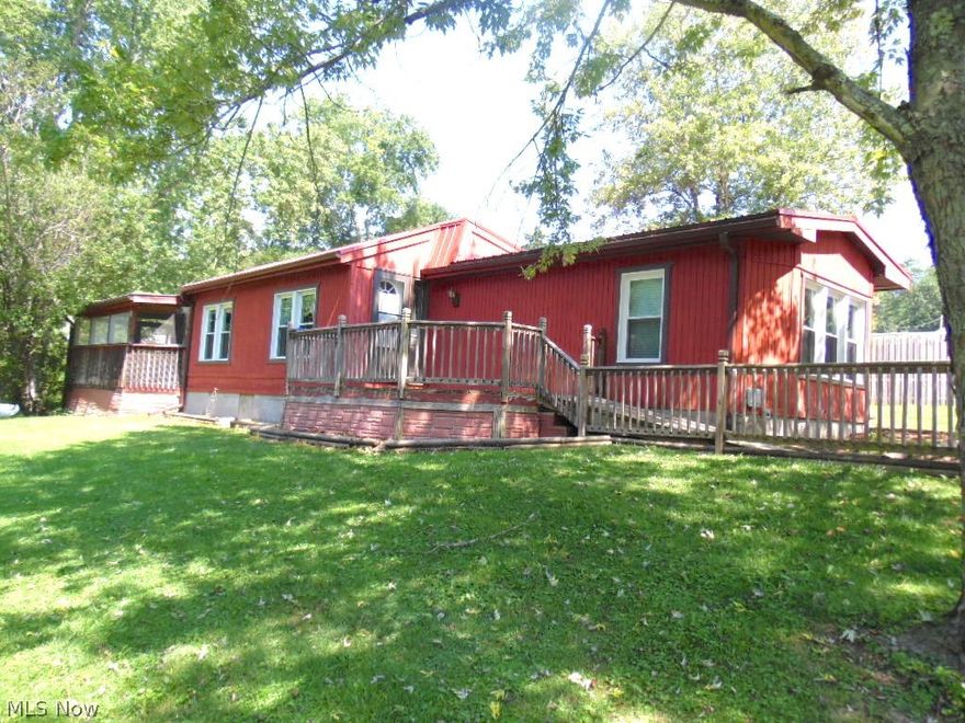 Close to town! This home sits on a great country setting! This 14x70 Innsbrook mobile home is on a block foundation and is in move-in condition. The property features 2 bedrooms, 2 full baths and living room with gas fireplace and wet bar. The property features large detached garage with storage and work bench and separate electric. You will love the wood deck and screened porch. Property has been updated to a 200 amp electrical service, replacement windows, newer furnace, newer flooring and central air!