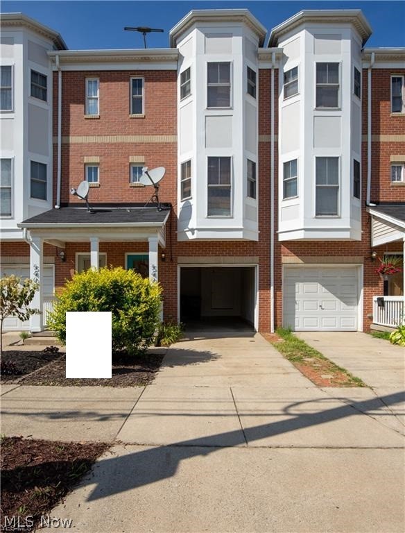 Feel the pulse of the city and embrace some of Cleveland's greatest features in this stunning two bedroom townhouse. Located near the corner of West 54th and Bridge avenue just a short commute from downtown and the West Side Market. Enter your new home and walk upstairs to the mid level where you will find the first bathroom, a fully loaded kitchen (all appliances included) and a dining room that overlooks the great room. Downstairs in the great room you are sure to feel comfortable thanks to the cozy feel that the new hard wood floors, two story ceiling and beautiful fire place give the room. The backyard is home to a spacious fenced in patio that is perfect for these summer months. On the third level is where you find the full bathroom with access from the hallway and master bedroom. Both bedrooms have large closets, vaulted ceilings and share the floor with a Hall laundry. There is plenty of storage and shelf space throughout the home but if you need more just look in the attached g
