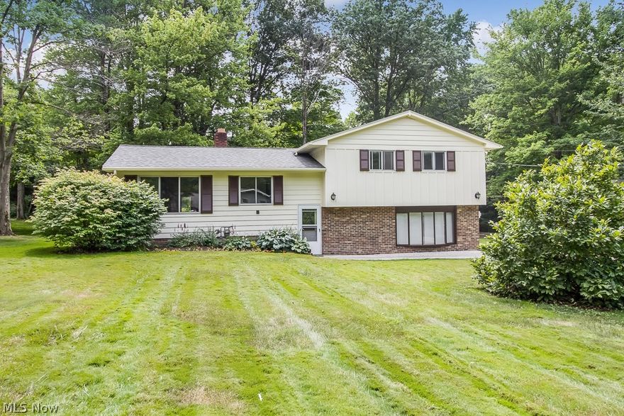 Beautiful split-level home on a 1-acre park-like lot in Kirtland!  This 3 bedroom, 2 full bathroom, home has gorgeous hardwood floors throughout that were just refinished!  The open family room and dining room flow around the cozy gas fireplace right next to the sun room with fantastic views of the back of the property.  The spacious master bedroom has its own private updated master bathroom attached and features a balcony overlooking the entire backyard.  New flooring in both updated full bathrooms.  All three bedrooms are good size and have plenty of closet space!  The home also features a brand-new roof with a 2-year warranty, fresh paint inside and out, and a large storage shed.  This one won’t last long! Check it out today!