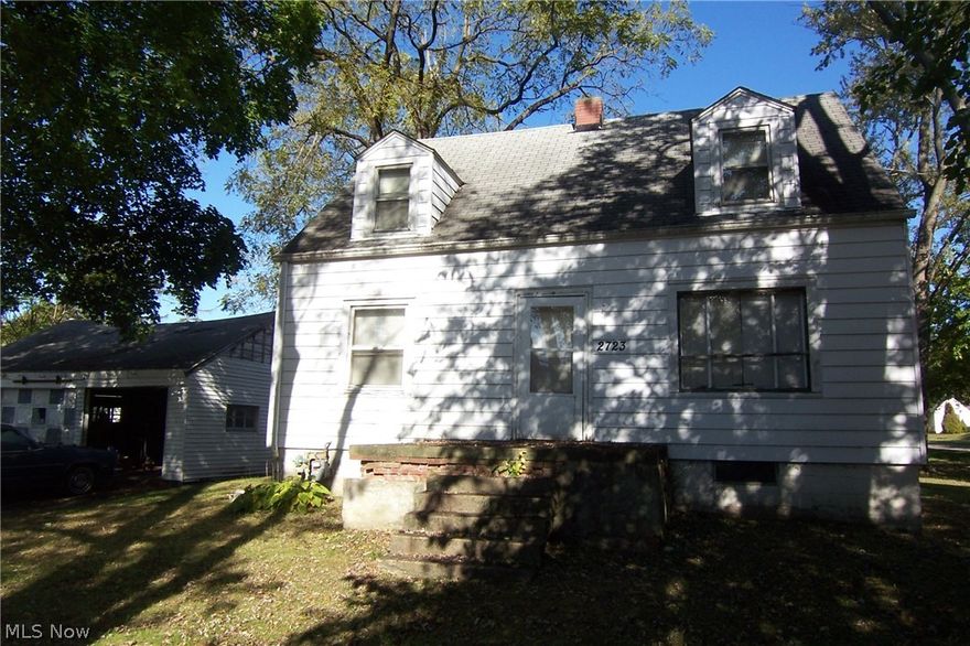 Potential! 3 bed on 3 lots with 3 car garage! Needs work! Full walkout basement! Garage has 220 line! Some hardwood floors! Rear deck/storage shed! City water & sewer!