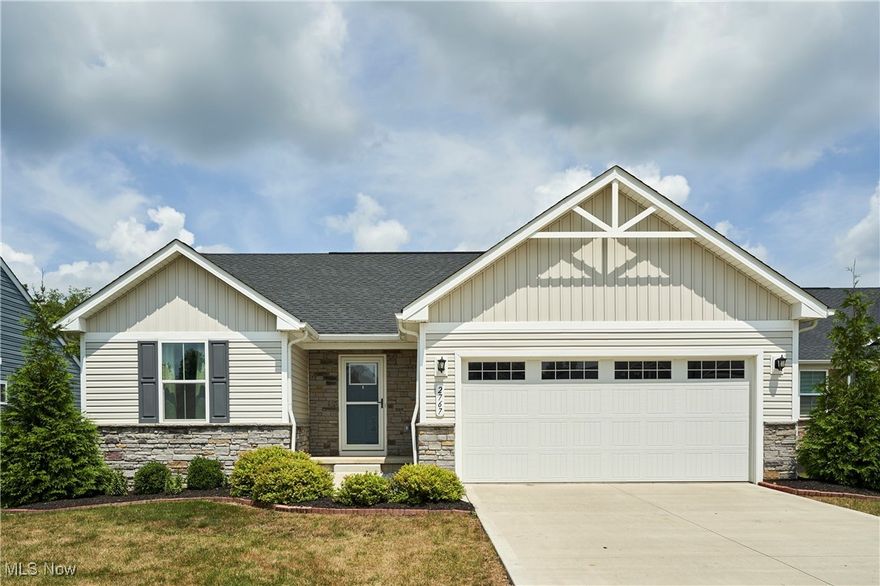 This beautiful ranch-style home in the sought-after Cider Ridge Ranches community in Norton was built in 2022 with numerous builder upgrades. This move-in-ready, low-maintenance home blends modern comfort with scenic views. The open-concept kitchen is bright and welcoming, featuring granite countertops, GE stainless steel appliances, and a spacious island—perfect for entertaining. This thoughtfully designed home offers 3 bedrooms, 2 full baths, and a 2-car garage. The private primary suite is located in its own wing and features an oversized walk-in closet and an en suite bath. The laundry room is just steps away for added convenience. Outside onto the newly added deck and patio, where you can relax while overlooking the tranquil pond and enjoy peaceful views of nature. The full lower level provides generous space with plumbing roughed in—ready for your custom finish. Enjoy stress-free living in one of Norton’s most desirable, low-maintenance communities.