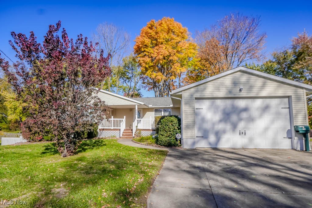 Set on nearly half an acre in North Canton Schools, this 2-bedroom, 2-bath ranch has a comfortable, easygoing feel from the moment you arrive. A covered front porch welcomes you inside to a spacious living area filled with natural light. The open layout connects to the dining space and kitchen, where you’ll find plenty of cabinet storage, all appliances, and room to gather for meals. French doors open to a bright enclosed porch that overlooks the yard, a peaceful spot to enjoy your morning coffee or unwind at the end of the day. Two bedrooms are tucked down the hall, including a primary suite with a walk-in closet and private bath. Downstairs, the walkout basement offers a gas fireplace, built-in shelving, and plenty of space for storage or hobbies. Outside, mature trees frame the yard, complete with a fire pit area for evenings under the stars. The oversized 20x40 garage provides workshop space and potential to hold up to four cars, adding great versatility for vehicles, tools, or projects. Conveniently located near shopping, dining, and highway access, this home offers a wonderful mix of comfort and potential.