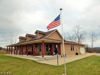 PRETTY AS A PICTURE OVERLOOKING THE LAKE!
It’s all about location and views from this beautifully built, quality home in Harrisville, WV!
This spacious, 2014 Amish built 3 bedroom, 4 ½ bath home sits at the end of the lane, on 3.6+/- acres and overlooks the North Bend Lake. Inside the home, you’re welcomed into an open living, dining, kitchen area with cathedral ceilings. The gas log fireplace keeps you cozy while you watch the winter come and go. There are split and spacious bedrooms, each having it’s own full bath! The kitchen has lots of custom cabinets and a great layout for the chef of the home! For added comfort and assurance, there is also a whole house generator for back-up power, if needed! If you enjoy being outside, take in the awesome views from the huge, covered concrete front porch. On the back side of the home, there is a covered patio, overlooking the woods and wildlife! Aside from the 2 car attached garage, there is an RV parking pad and huge pole building with