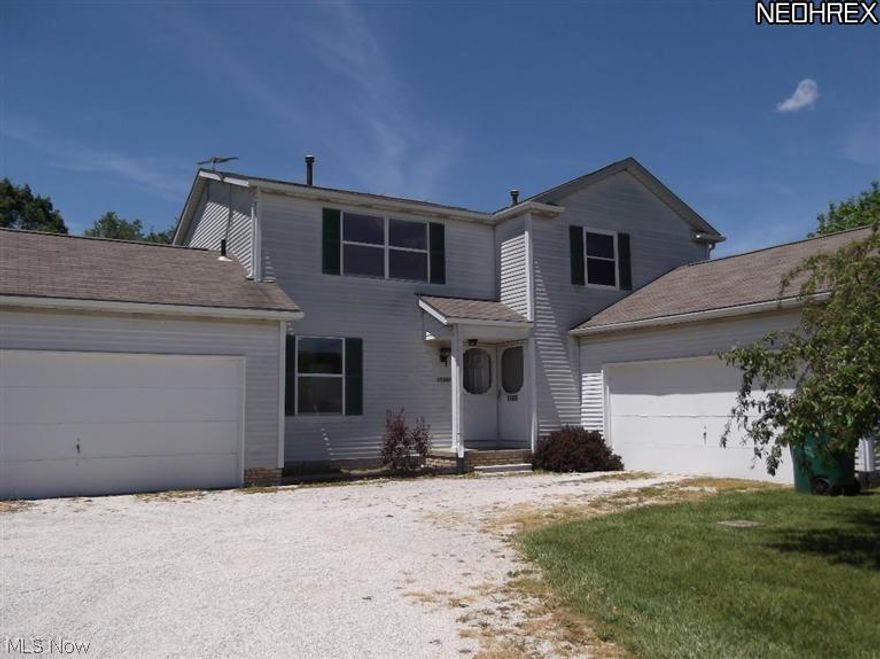 Each unit has 2 bedrooms, 1.5 baths, full basement, 2 car attached garage.  Comes with refrigerators and stoves.  Separate utilities.  Subject to new survey and new tax rate as this property currently is on 1 -2.44 acre parcel with another duplex.  Both duplexes may be purchased together as a package.  Other duplex is 11395-97 Market Ave N.  Located near schools and shopping, but has a nice country atmosphere.