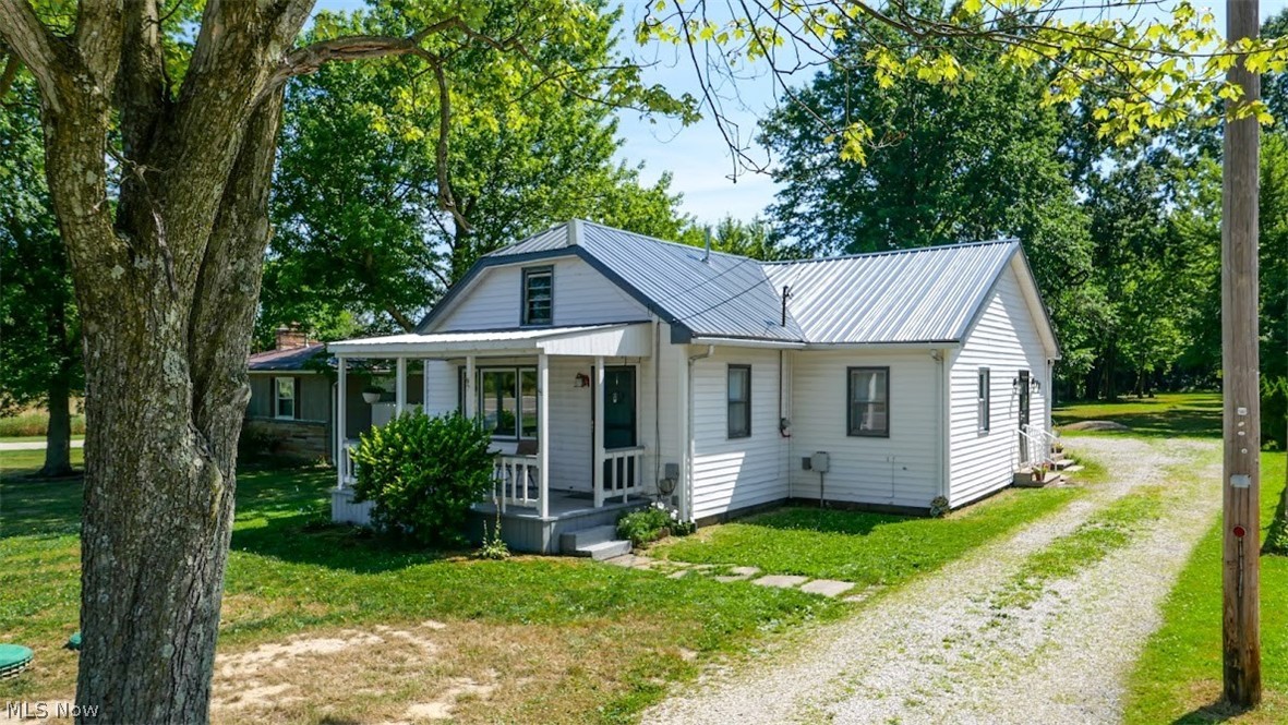 Take a look at this nice 3 bedroom ranch home with a 2.5 car detached garage with electric on 2 acres plus! This property features a nice back yard going into the woods. Some of the updates include: New septic in December 2022, New dishwasher, New refrigerator, New stove, all in 2022. New window blinds, New door locks, New ceiling fans, New exterior lights, New garage lights all in 2023, New gutter guards & downspouts in 2024. Updated kitchen cabinets & porch and front steps in 2024. This home is close to the Champion Schools. So make your move today before it's gone on this nice move in ready home!!