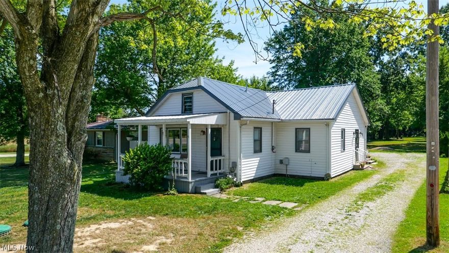 Take a look at this nice 3 bedroom ranch home with a 2.5 car detached garage with electric on 2 acres plus! This property features a nice back yard going into the woods. Some of the updates include: New septic in December 2022, New dishwasher, New refrigerator, New stove, all in 2022. New window blinds, New door locks, New ceiling fans, New exterior lights, New garage lights all in 2023, New gutter guards & downspouts in 2024. Updated kitchen cabinets & porch and front steps in 2024. This home is close to the Champion Schools. So make your move today before it's gone on this nice move in ready home!!