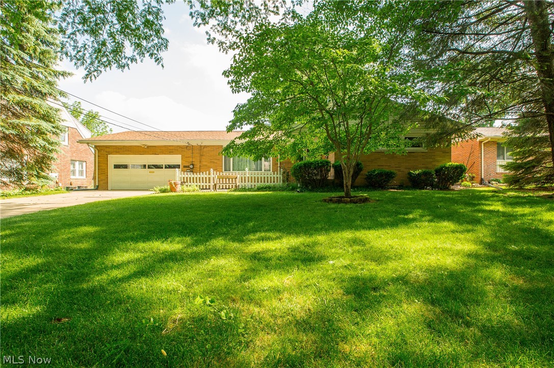 Very well maintained 3 bedroom ranch in great location near shopping and I-77 access. Interior has been recently painted, and sharp remodeled white eat-in kitchen ! Nice laminate flooring in open kitchen/dining area. Appliances stay including washer/dryer. So many updates- newer vinyl windows, new pump on well, water softener. Maintenance free exterior is brick with alum eaves. Generous size bedrooms with beautiful wood floors, large closets, and ceiling fans. Partially finished rec room in basement - is great for family get togethers. It has a gas fireplace, and there is a range in basement. Lovely yard with many perennials and a good sized shed in the rear.
Hurry- this one won't last!