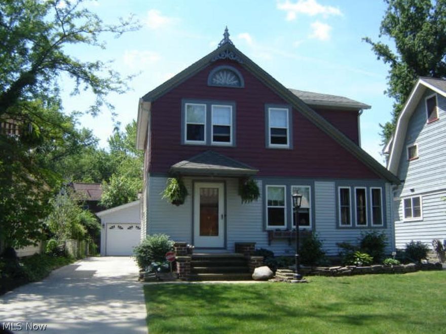 Elyria Colonial with Old World Charm. Old World charm includes beautiful wood work and hardwood floors. It also has a swinging door between the kitchen and dining room along with classic light fixtures with modern bulbs. The Kitchen has updated counter tops and added cupboards and wooden breakfast bar/ extra counter space, and the appliances stay. The Living room has decor fireplace and Glass doors leading into a bonus room that would make a great office or study. The outside boasts a decor brick patio, Fenced in yard and 2.5 car garage.
