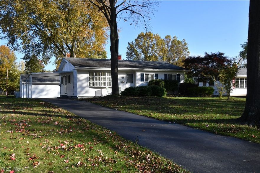 Come home and enjoy a morning cup of coffee on your front patio and enjoy the beautiful scenery. Once inside of this ranch you have a spacious kitchen with Corian counters and an adjoining dining room that flows into a large family room to entertain in.  You have three bedrooms with a full bath and a master suite with a half bath.  There is a carport and a detached 2 car garage to make parking easy.  There is a fenced in backyard to allow your pets to roam free.  The basement was just fully waterproofed by Ka -Ron and comes with a transferable warranty for your piece of mind.  There is an additional bathroom in the basement and a large laundry room.  The sellers are offering a 1 year warranty through 2-10 home warranty.