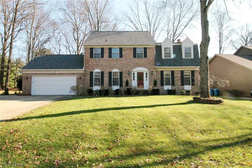 Welcome home to this gorgeous colonial on a wooded site. This fabulous open foyer welcomes you to this four bedroom, three and half bath home with living room and dining room offering natural light. The large kitchen offers plenty of cabinets and counter space  with a eating area that overlooks the adjoining family room with wood beam ceiling and wood burning/gas fireplace which is flanked by built in storage cabinets and bookcases. The kitchen has a newer sink, disposal and recessed lighting with gorgeous hardwood floors. The vaulted spacious sun room with ceiling fan has fabulous floor to ceiling windows that brings natural light all year round and accessed is a beautiful paver patio. The first floor finishes with the laundry room with cabinets and utility area, half bathroom. As you take the curved staircase upstairs to the second floor it leads you to the master suite and three additional bedrooms. The master suite has two walk in closets with full bathroom that offers skylights, m