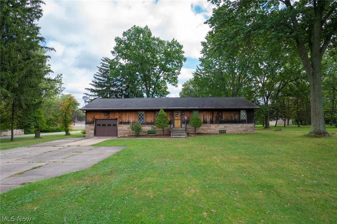 This custom-built home is located on just over 1.5 acres of land and features a large barn and a shed. Walk in to an extra large dining room with wood beams and hardwood floors. The eat in kitchen provides plenty of space and opens to the large sunk-in great room. The great room features a large stone fireplace, wood beams, high ceilings, and plenty of natural light. Each bedroom has a cedar closet as well as hardwood floors. Full bathroom has extra-large entrance. Don't miss out on this beautiful property located in the Norton School District.