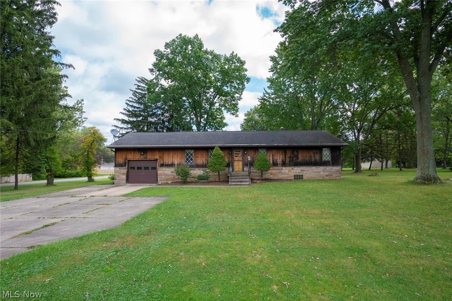 This custom-built home is located on just over 1.5 acres of land and features a large barn and a shed. Walk in to an extra large dining room with wood beams and hardwood floors. The eat in kitchen provides plenty of space and opens to the large sunk-in great room. The great room features a large stone fireplace, wood beams, high ceilings, and plenty of natural light. Each bedroom has a cedar closet as well as hardwood floors. Full bathroom has extra-large entrance. Don't miss out on this beautiful property located in the Norton School District.