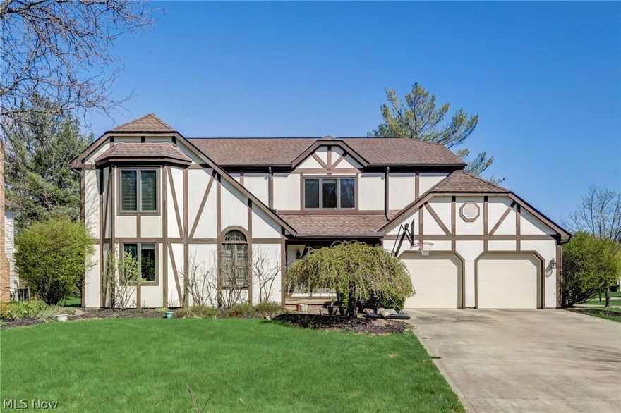 Introducing 5025 Boulder Creek Drive: a Tudor-style residence nestled in the prestigious North Solon area offering a blend of sophisticated updates and careful maintenance, making it move-in ready. Step inside to find a light-filled, two-story foyer leading to an elegant formal dining room on the left, adorned with sparkling hardwood floors. On the right, a well-lit office space features a sophisticated tray ceiling. Progress to the kitchen, where functionality meets style with its tile floors, stainless steel appliances—including a double oven and trash compactor—custom cabinetry, and beautiful countertops. The layout includes a breakfast bar and a dining area, with a deck just steps away, perfect for enjoying the backyard. Relax in the family room, where a gorgeous gas fireplace with a stone surround invites you to unwind, complemented by built-in shelving and a cozy window seat. The first floor is rounded out by a spacious laundry room and a half bath. The second floor houses a stunning primary suite with vaulted ceilings and two large closets, leading into an en suite that features an oversized tiled shower, glass surround, and a broad vanity with extensive cabinetry. Three additional bedrooms, each fitted with ceiling fans, share a full bathroom, completing the upper level. The basement is thoughtfully finished, providing ample space for leisure or work, equipped with built-in shelving and desk under recessed lighting. The outdoor area, framed by mature trees, includes a wooden deck ideal for entertaining. Schedule your viewing today to experience everything this fabulous home has to offer!