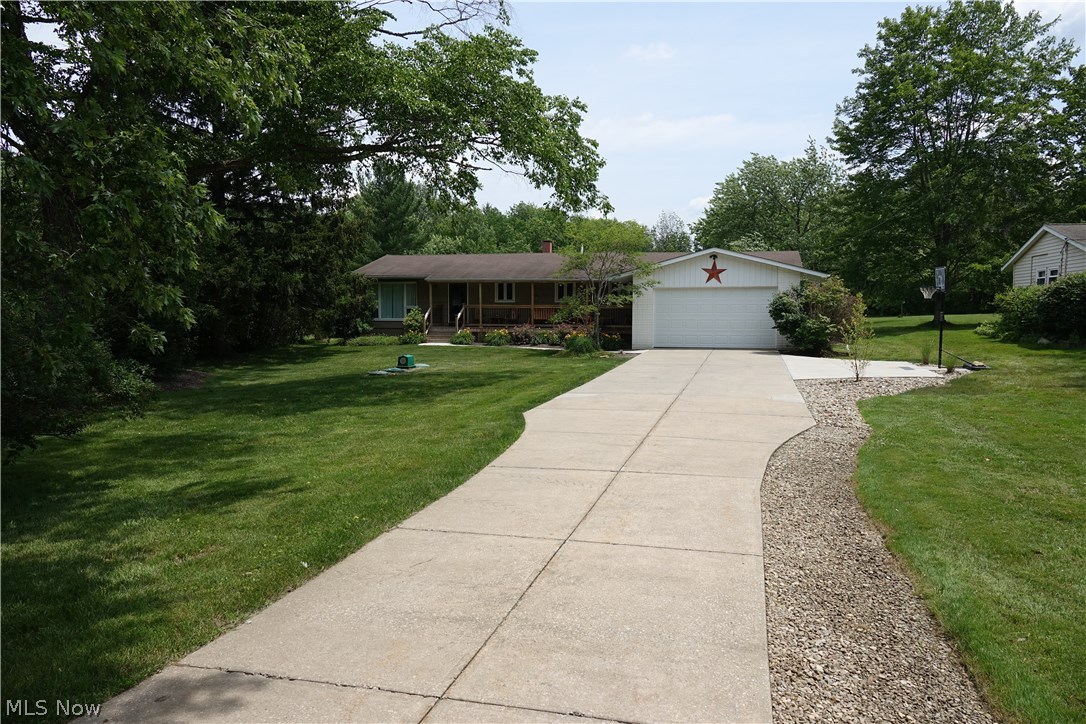 Spacious 4 bedroom ranch on 1 acre! Refinished wood floors throughout eat in kitchen & dining room. Rear patio & deck. Partially fenced in yard. 2 car attached garage. Finished Rec. Room. Move in condition. Show and sell!