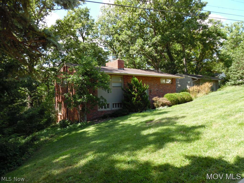 This very unique home's floor plan takes full advantage of its beautifully wooded lot with the openly designed first floor with large windows to take advantage of the secluded setting. The updated kitchen, dining area, huge family room with fireplace warmth and an office/den with attached laundry room and half bath are located on the first level. Three bedrooms and two full baths are on the second level. A must see for sure! MREI#5158 Elem: Washington Elementary School Elem/Bus: Y JrHigh: Marietta Middle School School JrHigh/Bus: N High: Marietta High School High/Bus: N Fire: CIT Police: CTY PossFreeGas: N ;SQFT=Fin L1:1120, Fin L2:1120, Fin Bsmt:0, Fin Above:2240, Fin Total:2240, Unfin Bsmt:0, Unfin Above:0;GAR= 2 Car Det, Opener(s)