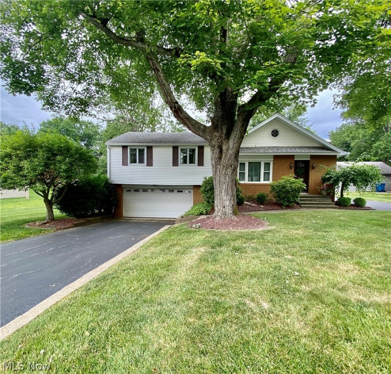 This immaculate home has so much to offer! Situated in a quiet neighborhood on a roomy double lot, the exterior features a large yard, oversized deck with a retractable awning, attached garage and a detached garage. Step inside to find a spacious living room flowing into the dining room and oversized kitchen. All appliances stay! Other highlights include a cozy family room with beautiful gas fireplace, 4 bedrooms, 2.5 baths, and a full basement with kitchenette, bathroom, storage space and access to the attached garage. One year home warranty included!
