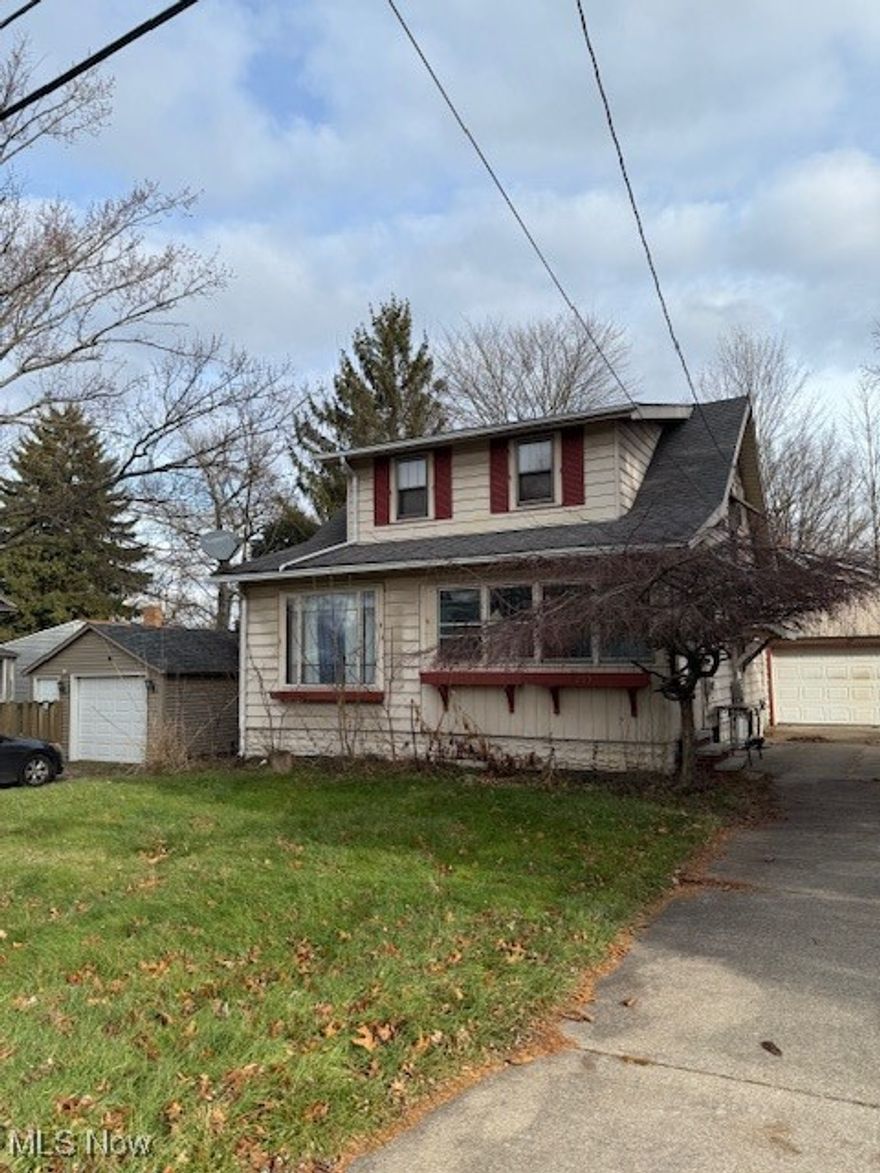Welcome to 295 Goodview Ave. in Akron.  This home has been rented out for the last few years, and is in need of some TLC but has good bones and could be the perfect fit for a first time home buyer, or an investment opportunity.  The property is situated on a double lot with a total of 0.1772 acres of property.  The home itself has a total of 1035 square feet of living space featuring 2 bedrooms, 2 full baths, and a full basement.  As you make your way  the side door you will see a decent sized kitchen that is fully functional which includes a range, fridge, dishwasher and a lot of cupboard space.  Off the kitchen there is a sun room with lots of windows and sky lights.  You will also see a really good sized dining room with original hardwood floors, built ins, and very nice wood trim. On the main floor there is a decent sized living room that also features original hardwood floors and trim.  There is also a nook, or could be an office that is attached to the living room.  As you make your way upstairs you will see the two bedrooms that are both really good sized and both have hardwood flooring, and a full bathroom that could use some updating.  There is a full basement that appears to be very dry, and features an updated furnace, and another full bathroom.  The exterior of the home has had some updates over the years with a newer roof and vinyl siding.  There is also a two car detached garage and another small building.  Come take a look and see the potential of this well built home.